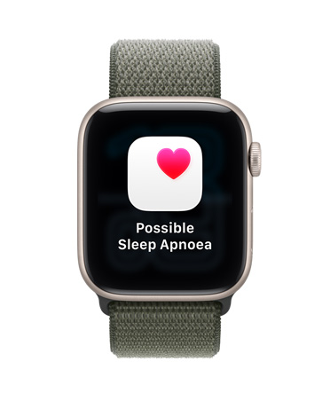Apple Watch SE 3, aluminium case, starlight colour, possible sleep apnoea notification, pink heart in white box, right side exterior, Digital Crown, Sport Loop, forest colour