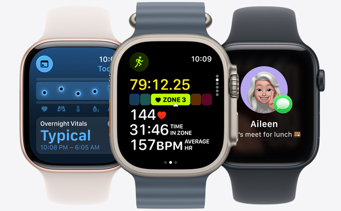 Three Apple Watch models, center in Natural color, face shows run in progress with heart rate stats, right in Jet Black, face with Genmoji, left in Rose Gold, face shows Vitals
