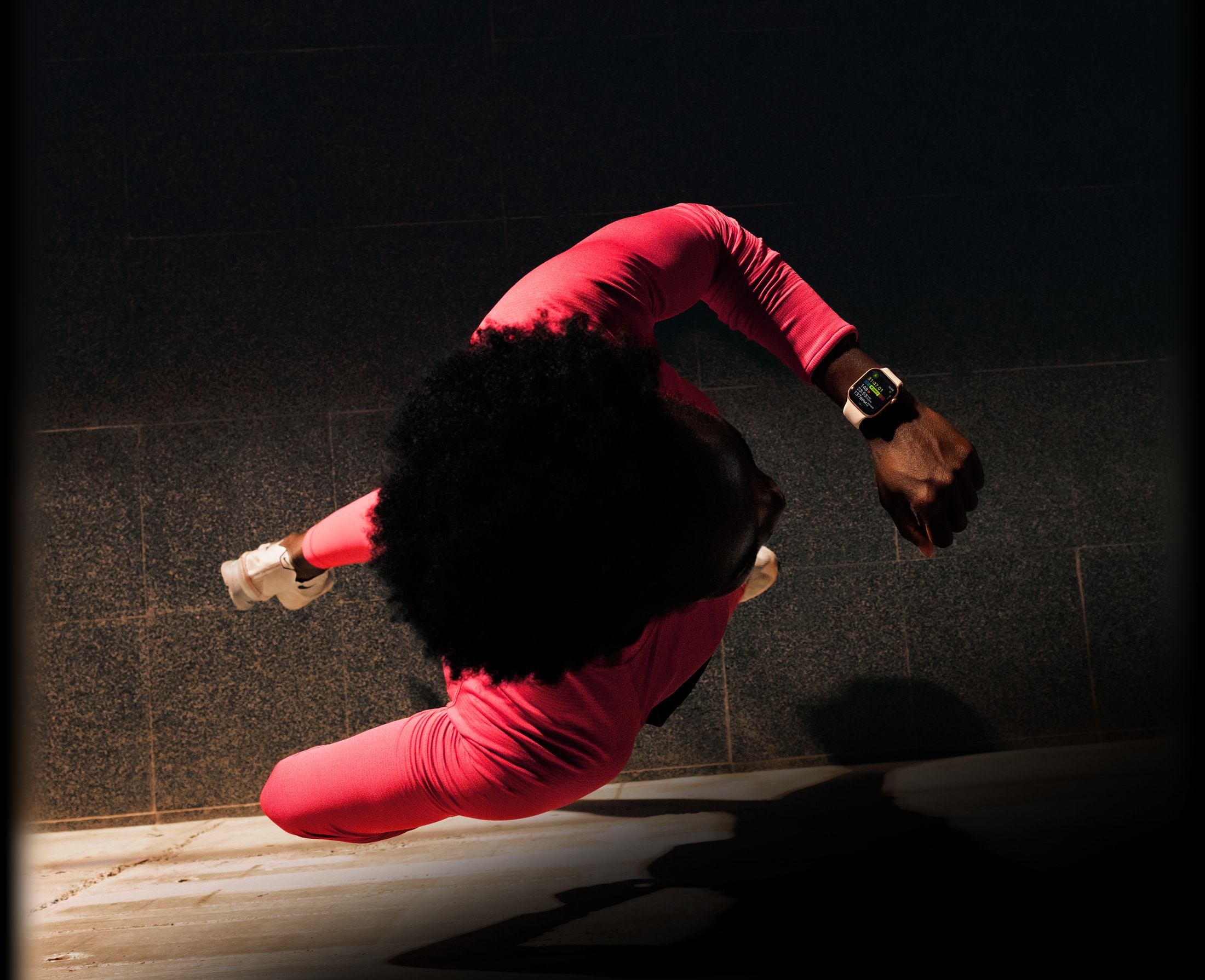 A person checks progress on Apple Watch Series 11 Workout app while running