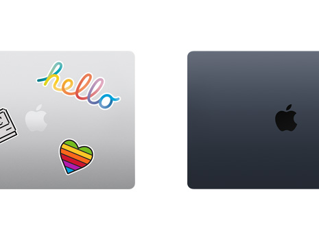 兩部合上的 Mac 手提電腦俯視圖，一部 Mac 用貼紙裝飾。