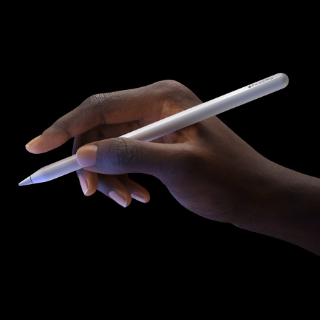 User holds Apple Pencil Pro showcasing double tap feature.