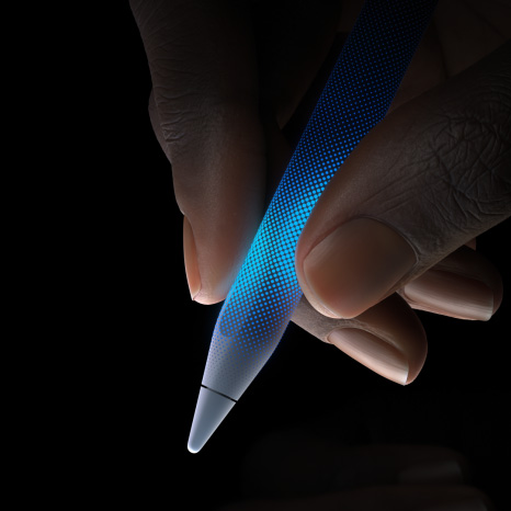 User holds Apple Pencil Pro. Area before tip of Apple Pencil is touch sensitive, showcasing the haptic feedback.